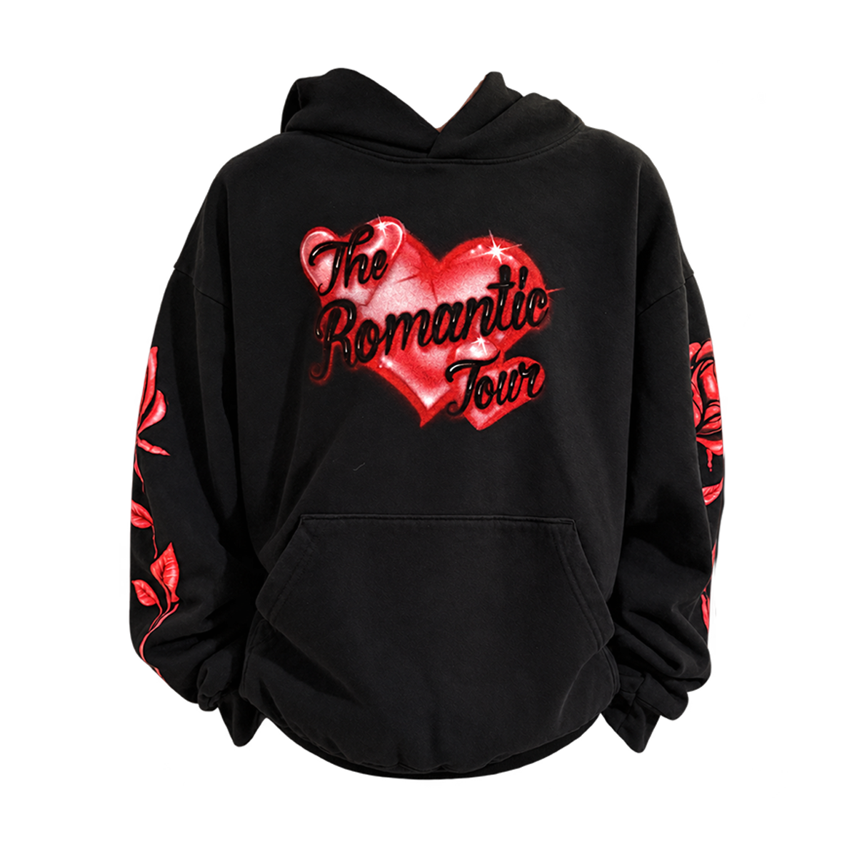 A black pullover hoodie featuring a large red heart graphic on the chest with the text 'The Romantic Tour' in black script. Red rose illustrations are printed down both sleeves.